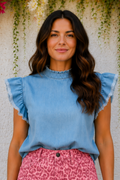 * Round ruffle neck
* Flutter distressed sleeve
* Denim
* Pearl style keyhole closure
* Pleated
* No stretch 