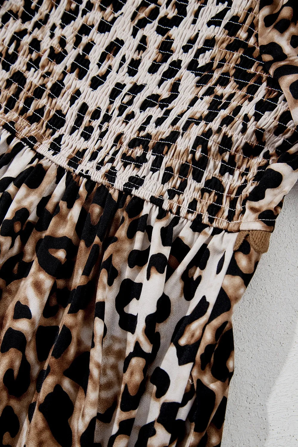 Tiered, pleated ruffled, pocketed, short puff sleeve, off shoulder leopard print, scalloped trim, square neck, unlined, opaque, slightly stretchy, maxi dress close up view