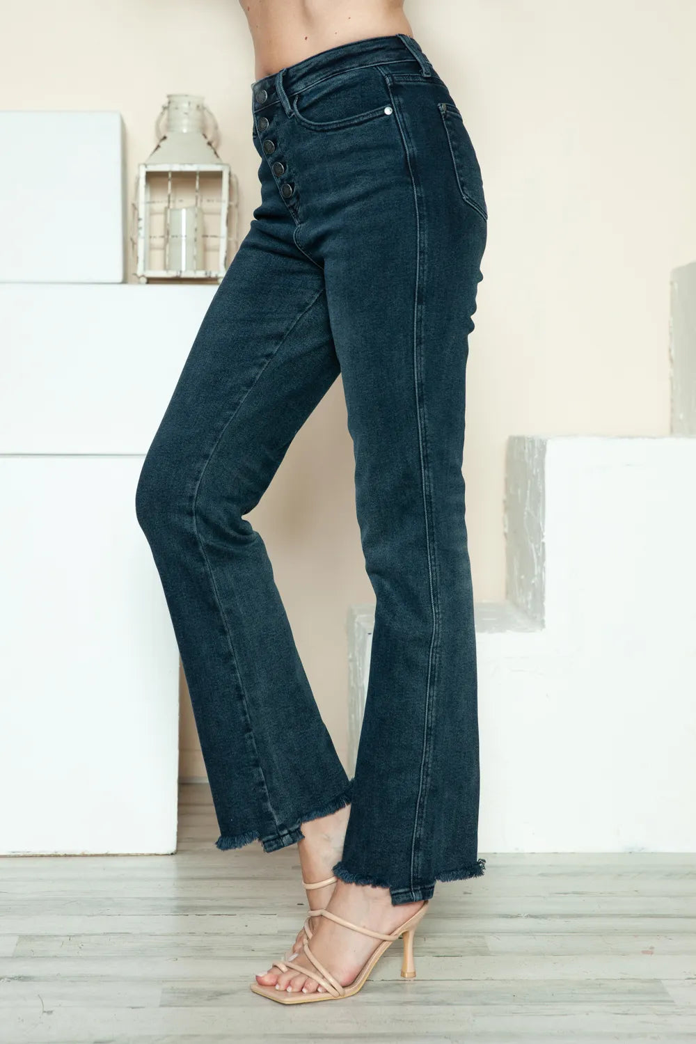 Judy Blue Button Fly Straight Leg Jeans feature a dark wash, raw hem, stretch fit, and classic pockets side view