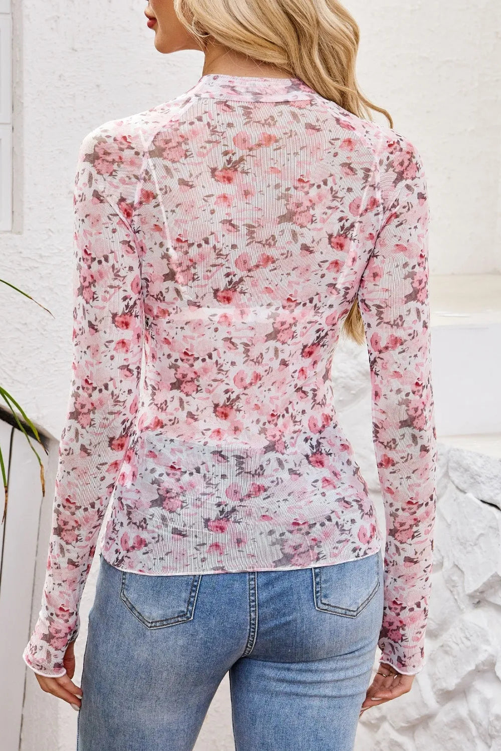 top, mesh, floral print, mock neck, long sleeve, thumb hole, stretchy, back view