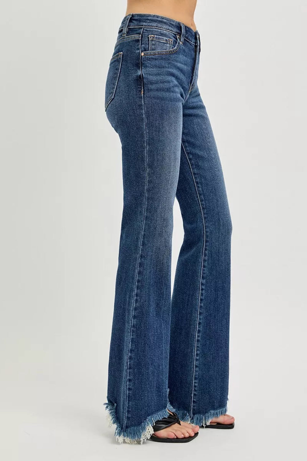Risen Jeans, full-size, mid-rise, frayed hem, flared leg, dar wash, pocketed, belt loops, button/zipper closure, slightly stretchy, side view