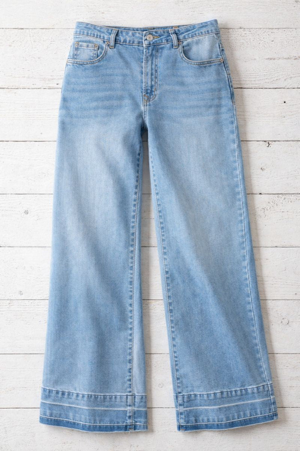 Jeans, high-rise, drop hem, raw hem, wide leg, pocketed, belt loops, button/zipper closure, vintage wash, some stretch, front view