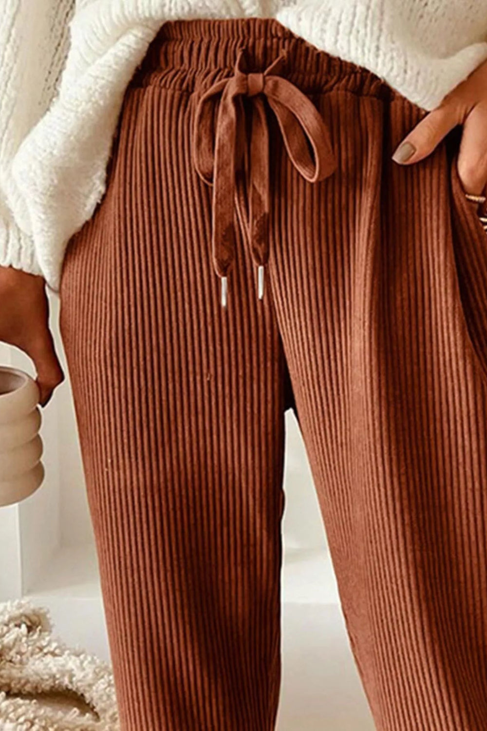 Pants, corduroy, drawstring, pocketed, elastic waist, high-rise, straight leg, no stretch, front close up view
