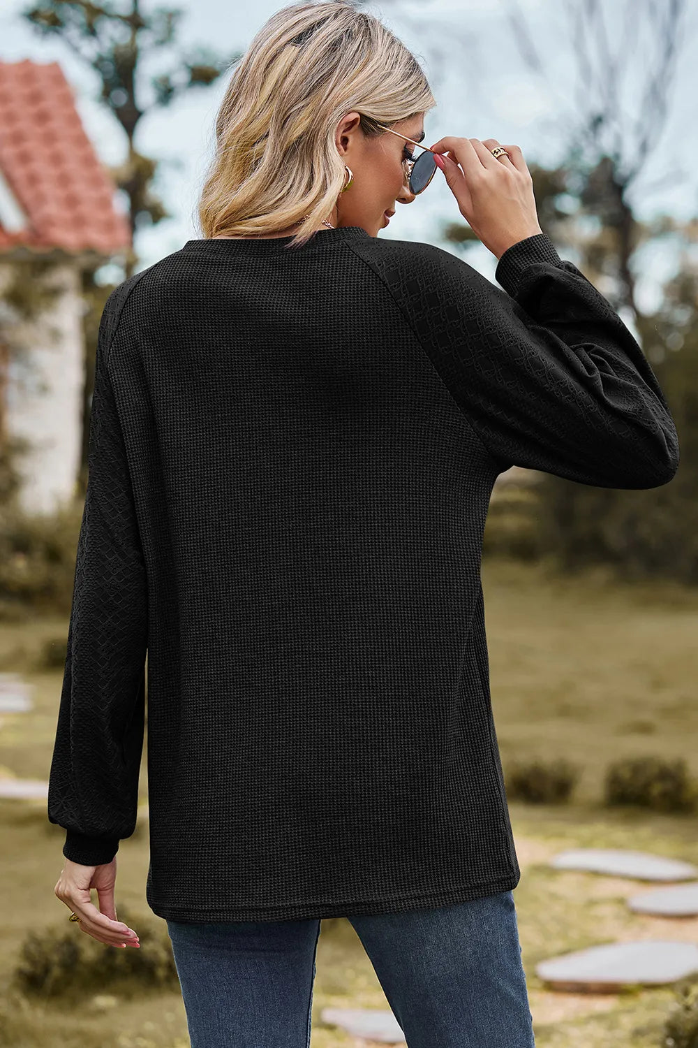 Top, raglan style, round neck, long sleeve, eyelet sleeves, ribbed, opaque, slightly stretchy, back view