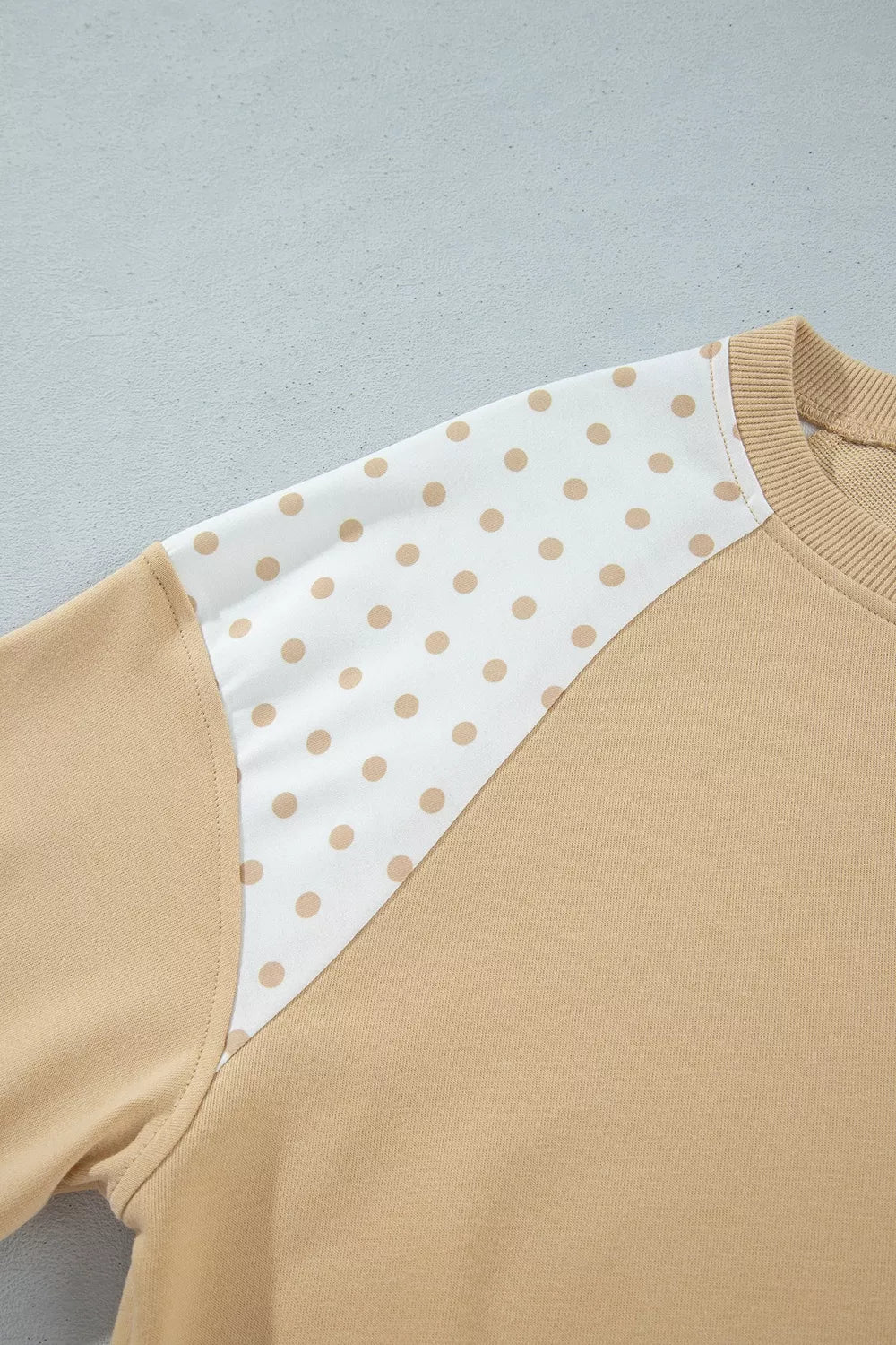 * Two-piece pant set
* Polka dot patchwork
* Round neck
* Long sleeve
* Drop shoulder
* Ribbed
* Oversized top
* Sits at waist
* High-waist
* Elastic waist
* Drawstring
* Pocketed
* Wide leg
* Slightly stretchy