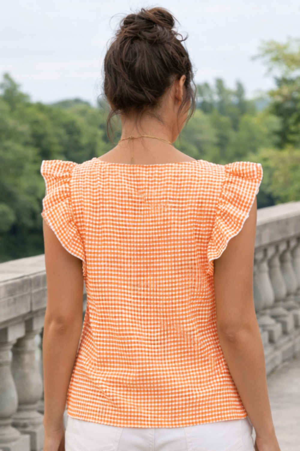 * Gingham top
* Square neck
* Ruffled sleeves
* No stretch