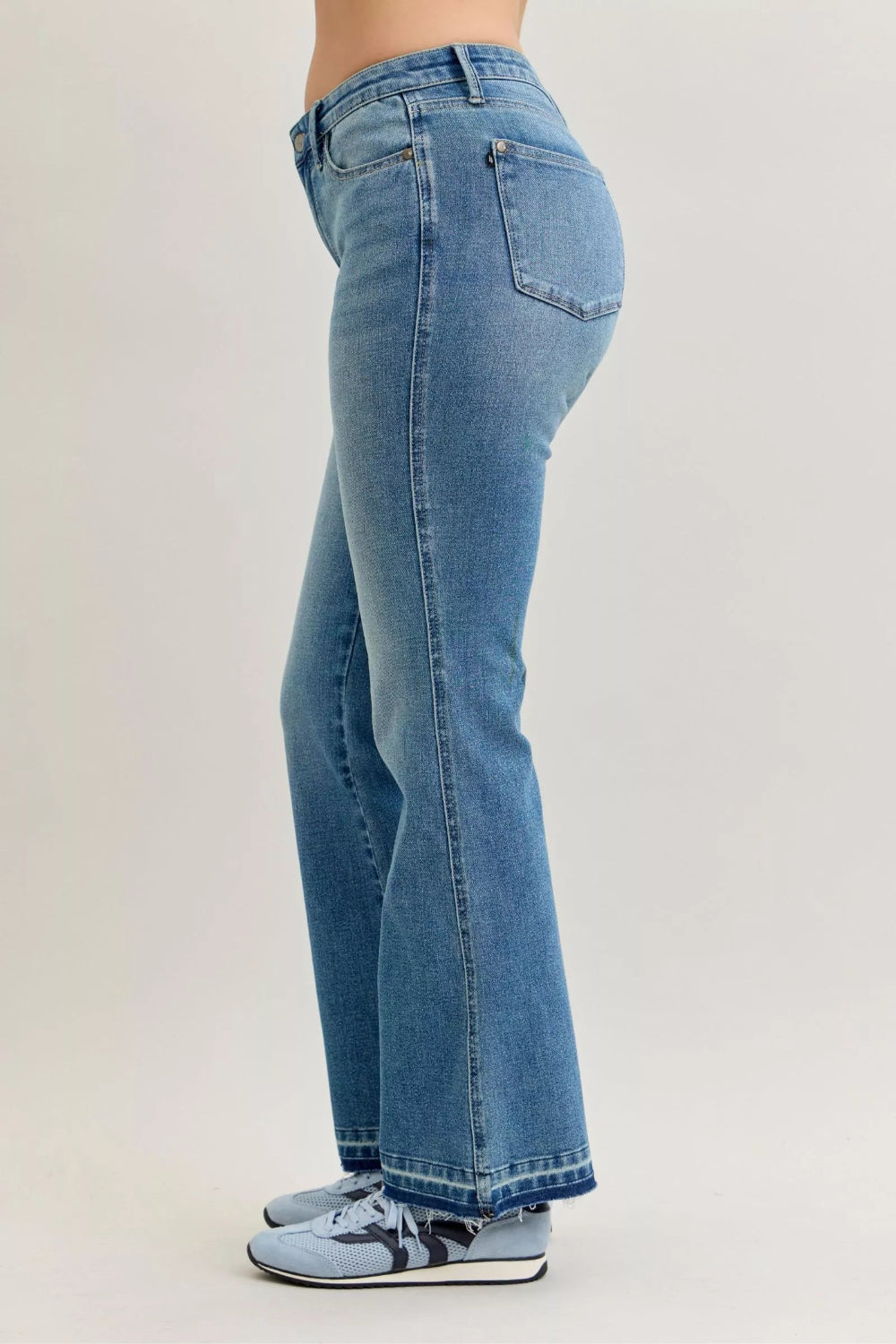 Judy Blue Jeans, full-size, mid-rise, medium wash, slim, bootcut, tummy control, release hem, pocketed, belt loops, button/zipper closure, raw hem, slightly stretchy, side view