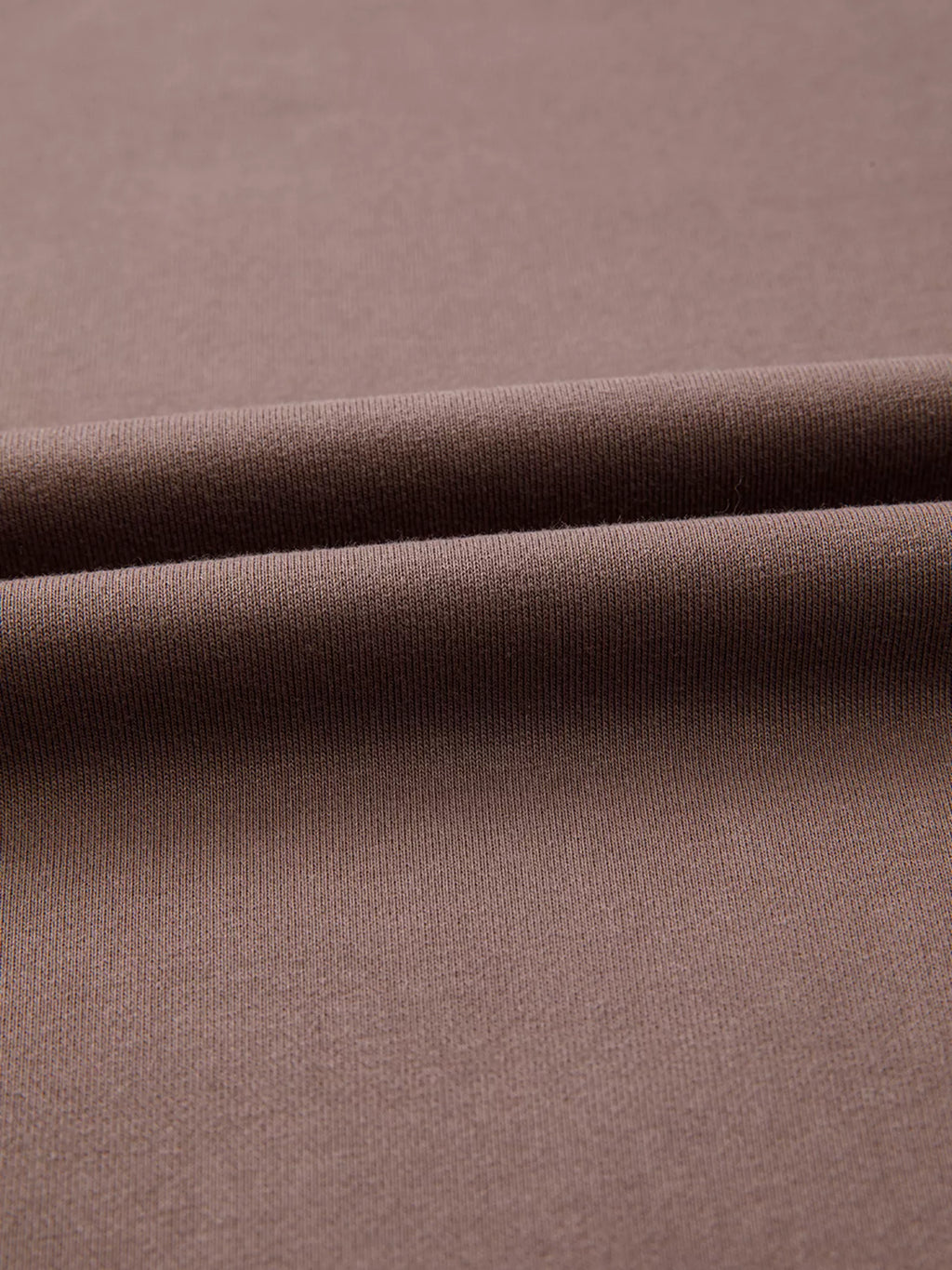 A Change Of Pace Sweatshirt in mocha brown with rust-orange and cream color-block sleeves, shown close up view.