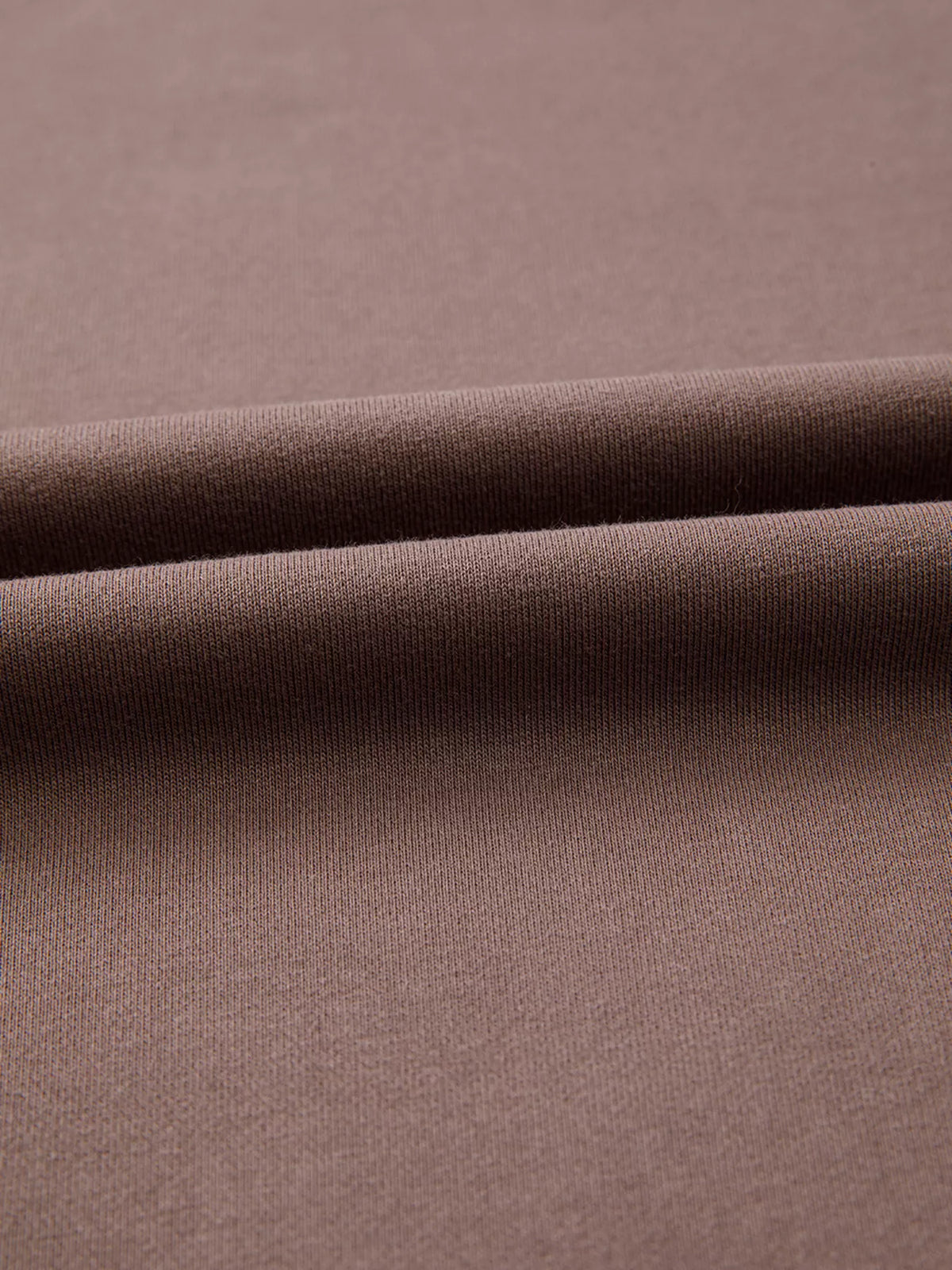 A Change Of Pace Sweatshirt in mocha brown with rust-orange and cream color-block sleeves, shown close up view.