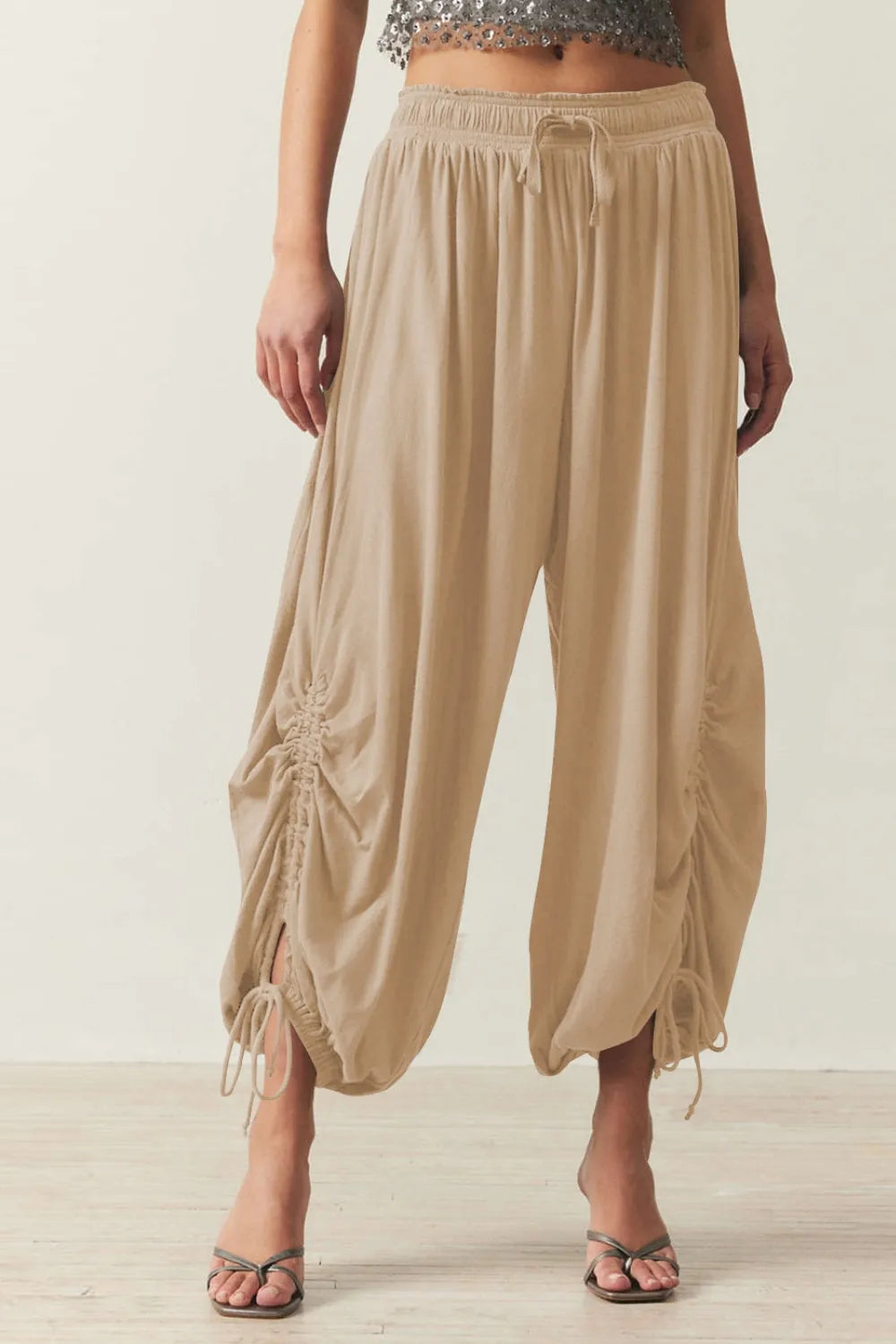 Pants, opaque, ruched, drawstring, elastic waist, opaque, pleated, adjustable hem ties, no stretch, front view

