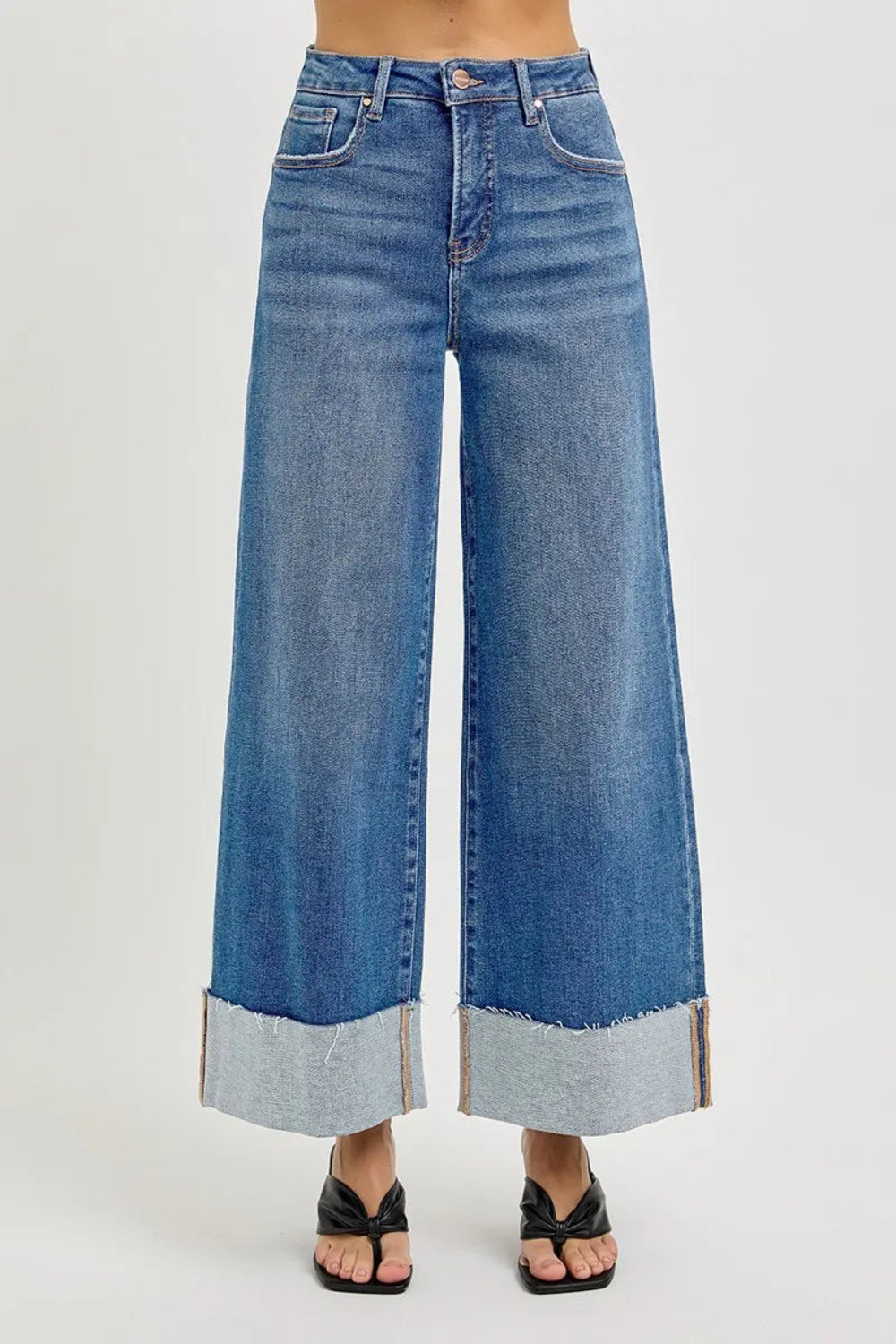 Risen blue jeans, full-size high-rise, tummy control, cropped, wide leg, cuffed, 5-pocket detail, button-zipper closure, belt looped, raw hem, medium wash, slightly stretchy, front view