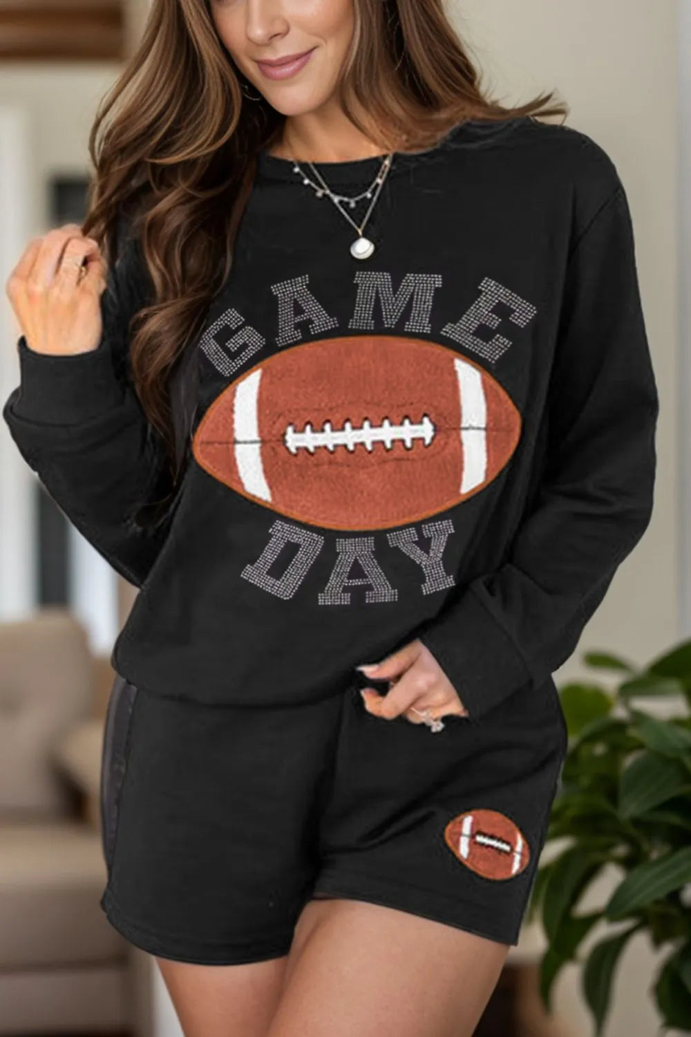 Two-piece short set, long sleeve, pullover, round neck, rhinestone lettering, football patches on top and shorts, side contrast trim, high waist, no drawstring, pocketed, no stretch front view
