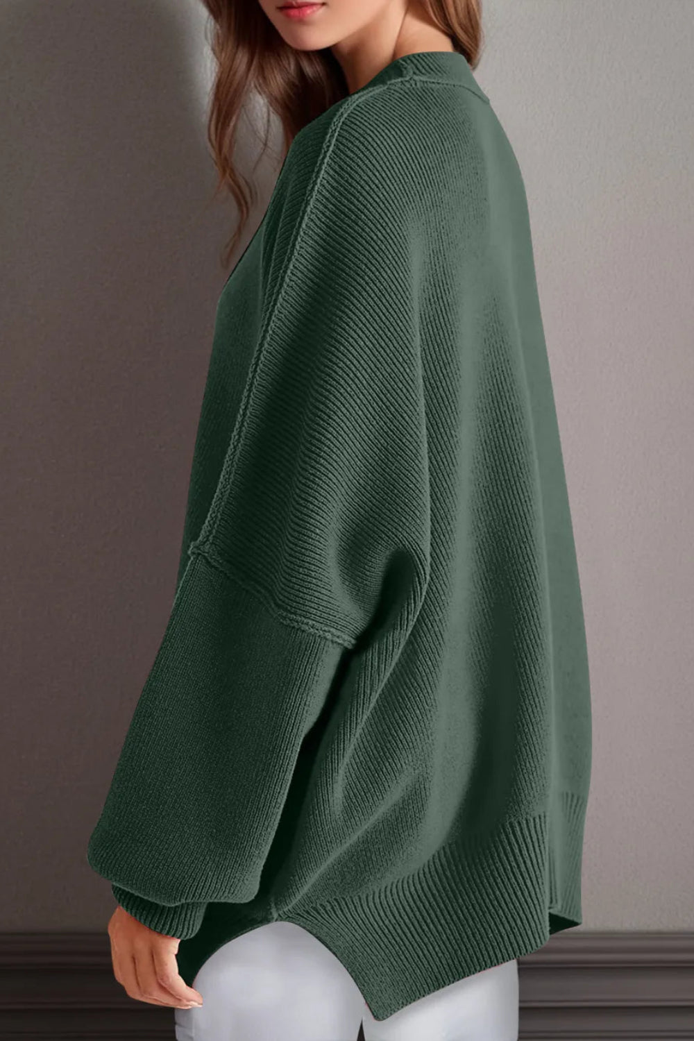 Sweater, oversized, drop shoulder, round neck, exposed seam, long, side slit, ribbed, stretchy side view
