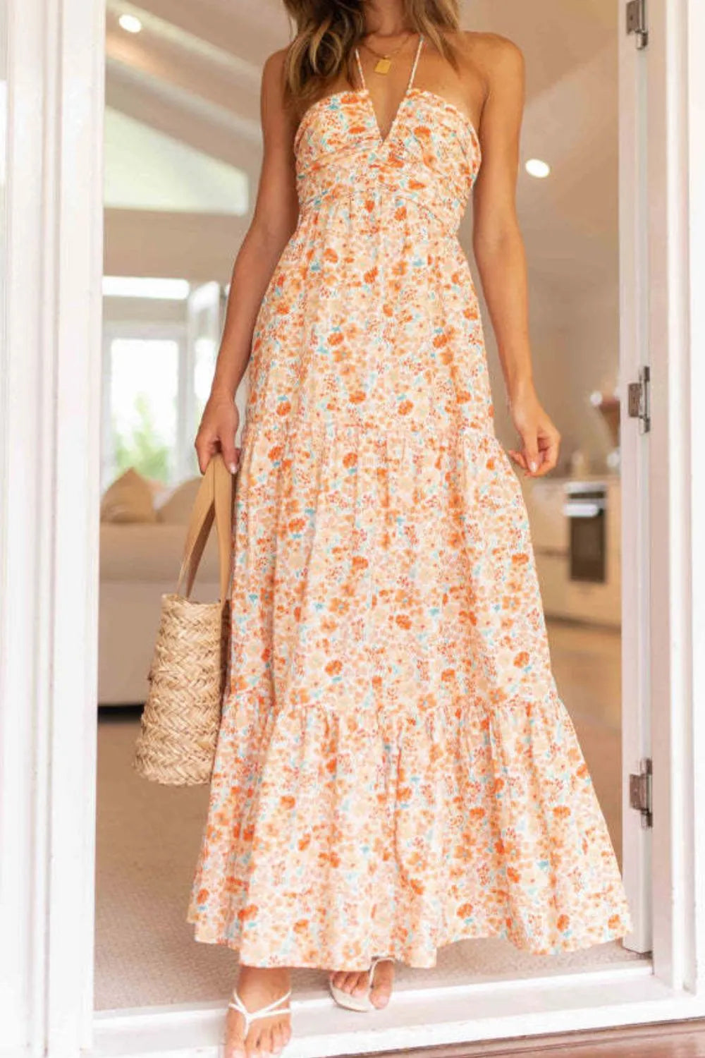Maxi dress, back zipper, halter tied, v-neck, ruched, tiered, ruffled, partially lined, no stretch, front view