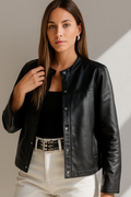 Faux leather jacket, buttoned, pocketed, lined, boxy, no stretch front view