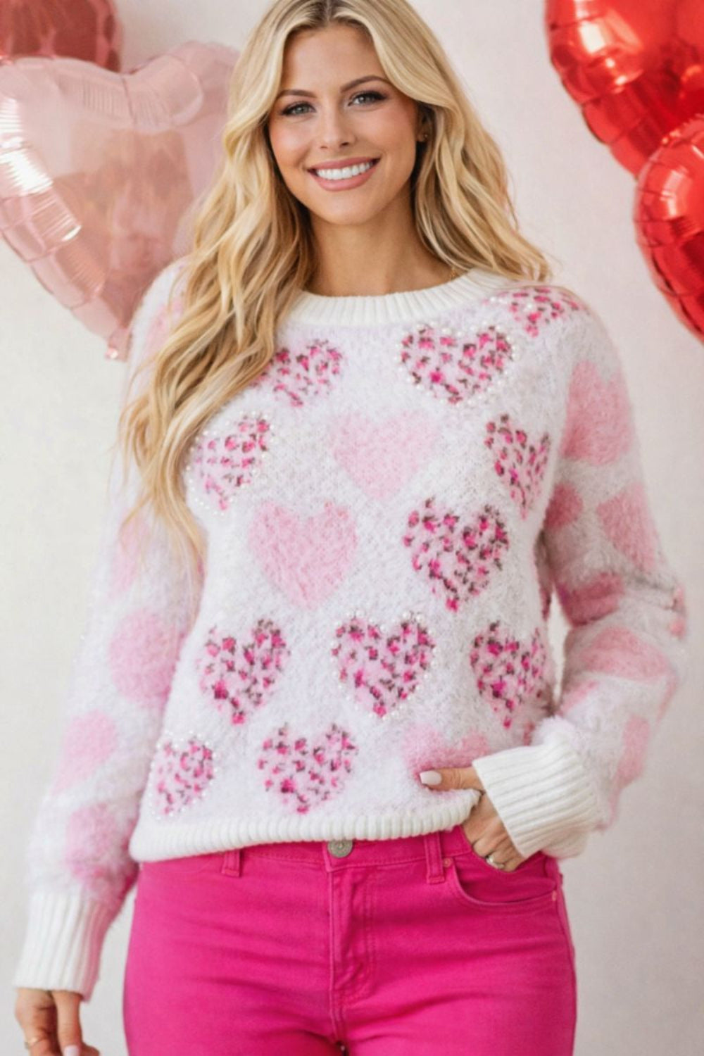 sweater, pullover, round neck, drop shoulder, ribbed neck, cuffs and hem, long sleeve, fuzzy texture, hearts with leopard print adorned with pearl trim, slightly stretchy, front view