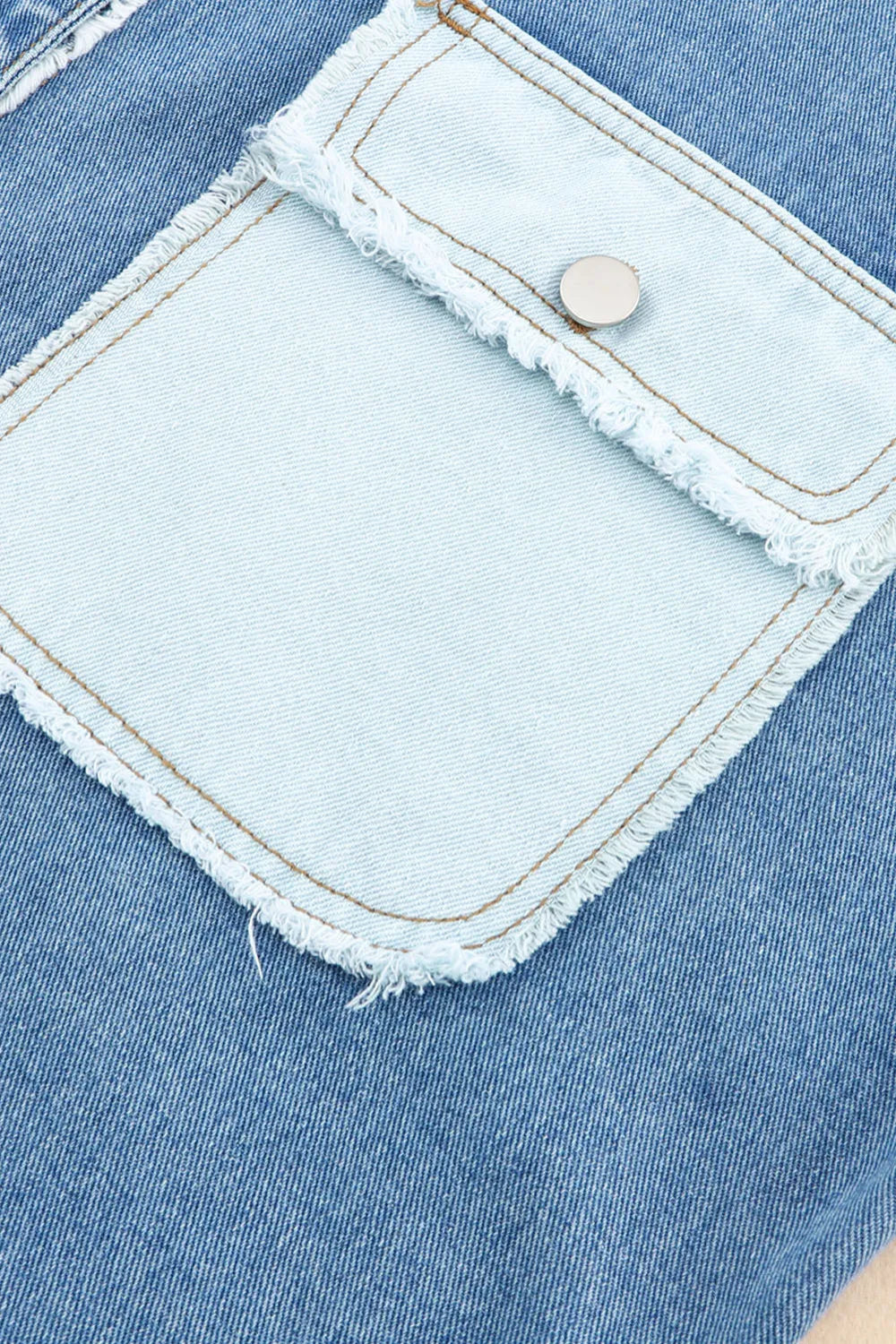 Denim jacket, colorblock, button down, raw hem, pockets, collared, no stretch, exposed seams close up