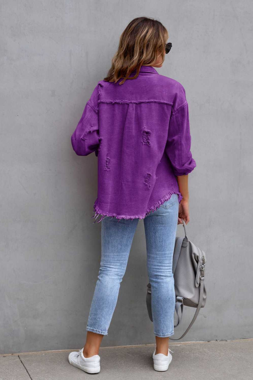 denim jacket, long sleeve, collared, buttoned, buttoned front patch pockets, distressed, fringed/raw hem, no stretch, multiple colors, back view