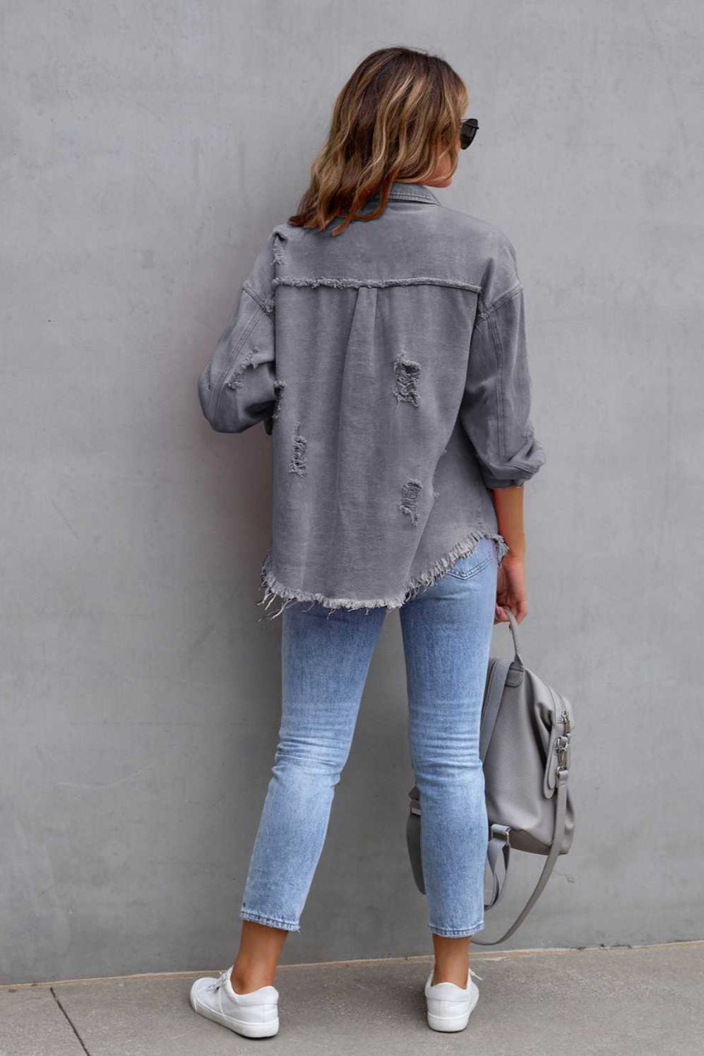 denim jacket, long sleeve, collared, buttoned, buttoned front patch pockets, distressed, fringed/raw hem, no stretch, multiple colors, back view