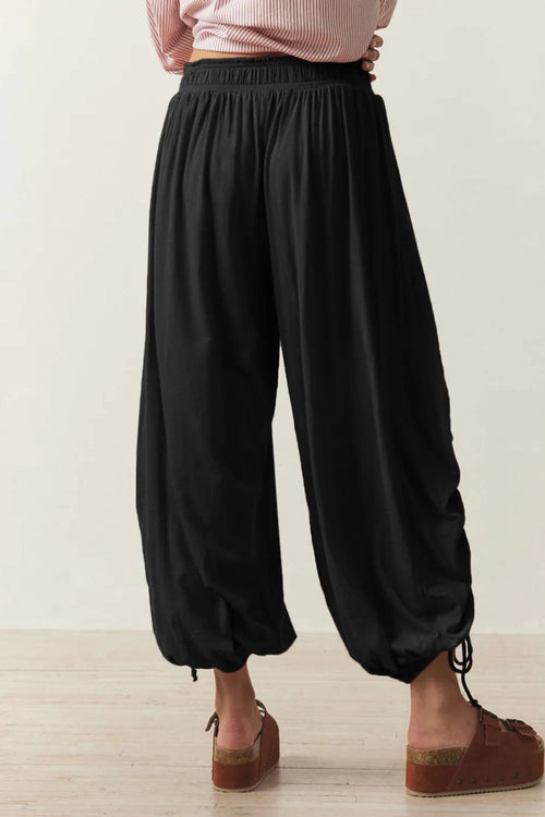 Pants, opaque, ruched, drawstring, elastic waist, opaque, pleated, adjustable hem ties, no stretch, back view

