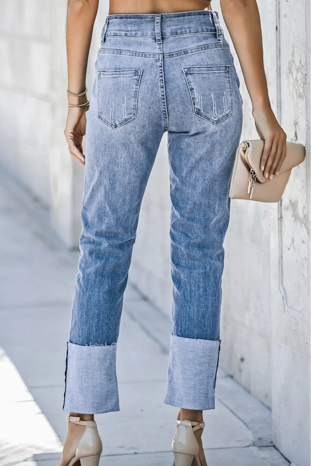 Jeans, straight leg, high-rise, distressed, pocketed, belt loops, raw hem, double button/zipper closure, slightly stretchy, back view