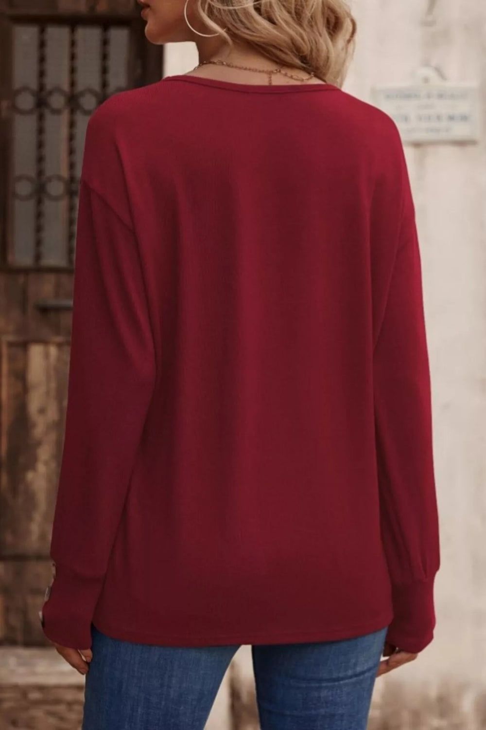 top, long sleeve, drop shoulder, v-neck, pullover, decorative buttons, straight hem, comes in many colors, stretchy, back view