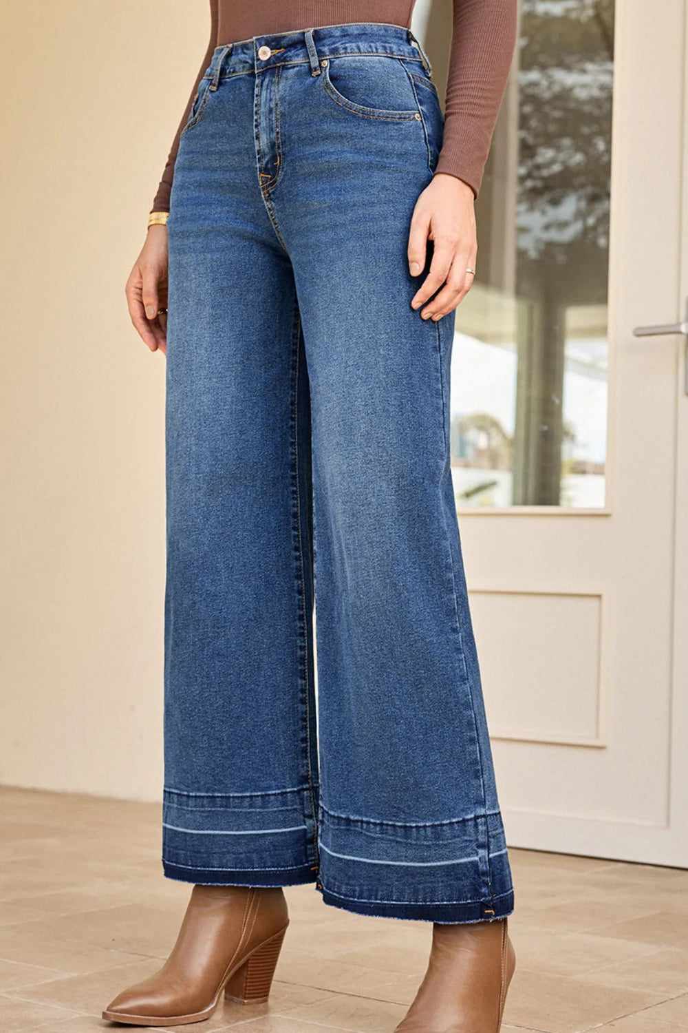 Jeans, high-rise, drop hem, raw hem, wide leg, pocketed, belt loops, button/zipper closure, vintage wash, some stretch, front view