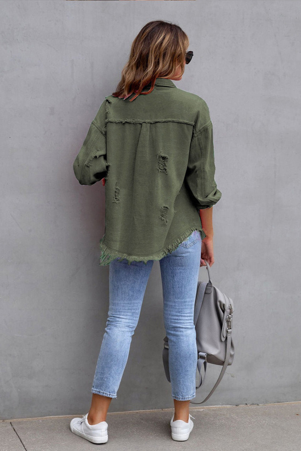 denim jacket, long sleeve, collared, buttoned, buttoned front patch pockets, distressed, fringed/raw hem, no stretch, multiple colors, back view
