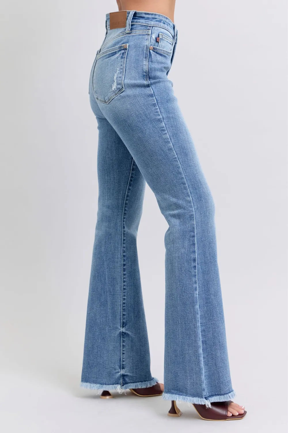 JUDY BLUE FULL-SIZE HIGH-RISE RAW HEM BOOTCUT JEANS SIDE VIEW