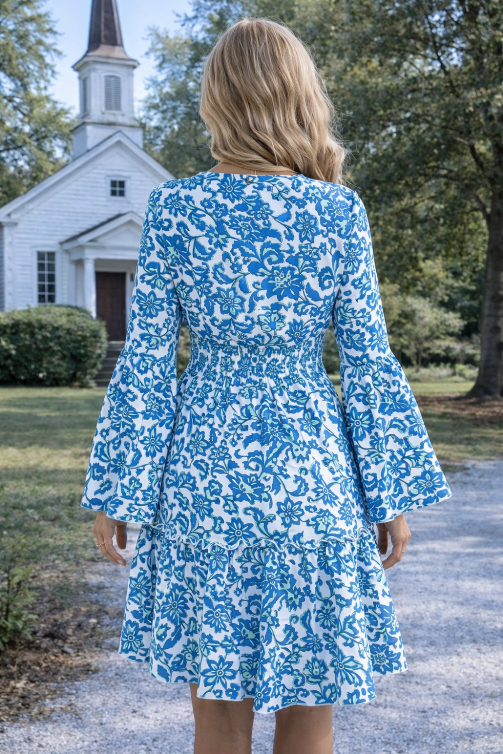 * Midi Dress
* Smocked
* Long flared sleeve
* V-neck
* Tiered
* Ruffle hem
* Unlined
* Slightly stretchy