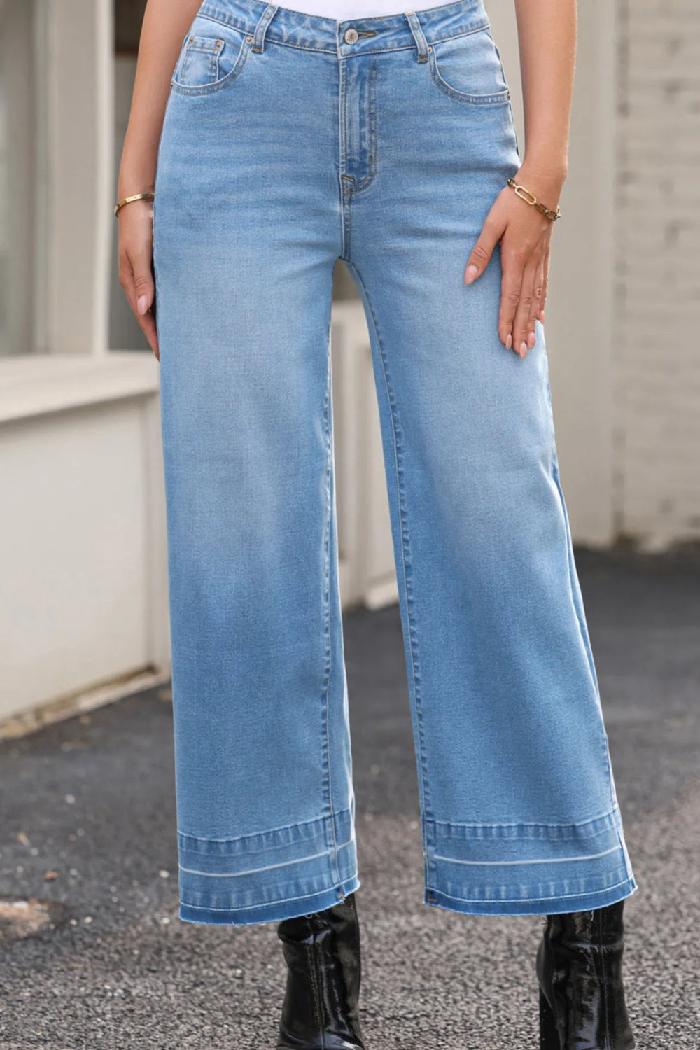 Jeans, high-rise, drop hem, raw hem, wide leg, pocketed, belt loops, button/zipper closure, vintage wash, some stretch, front view