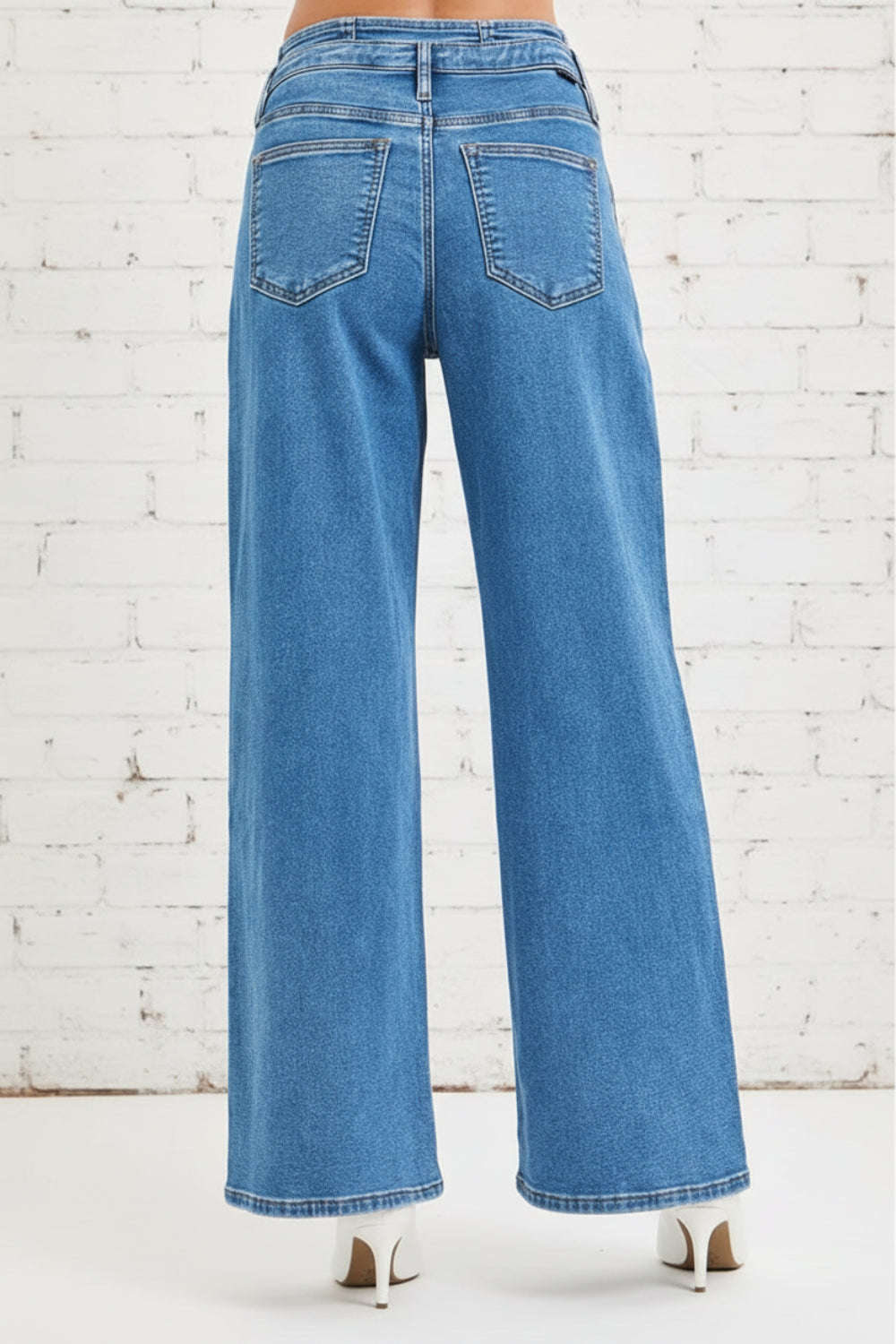 Risen Jeans, full-size, mid-rise, pleated, wide leg, medium wash, pocketed, belt loops, double button/zipper closure, slightly stretchy, back view
