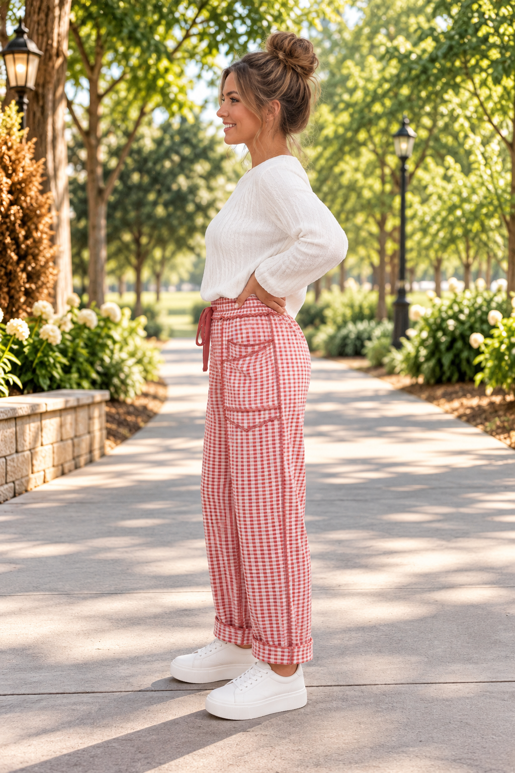 The Reece Pants in red and cream gingham with wide cuffed legs, a drawstring waist, front pockets, and vertical seams side view.