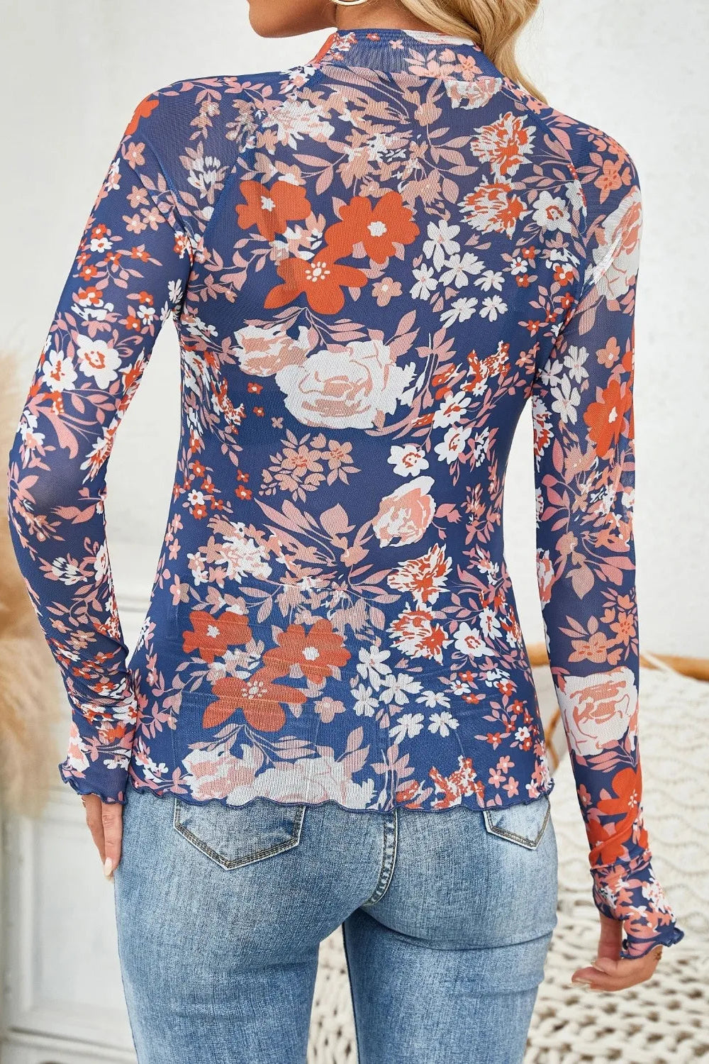 top, mesh, floral print, mock neck, long sleeve, thumb hole, stretchy, back view