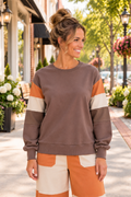 A Change Of Pace Sweatshirt in mocha brown with rust-orange and cream color-block sleeves, shown from the front.