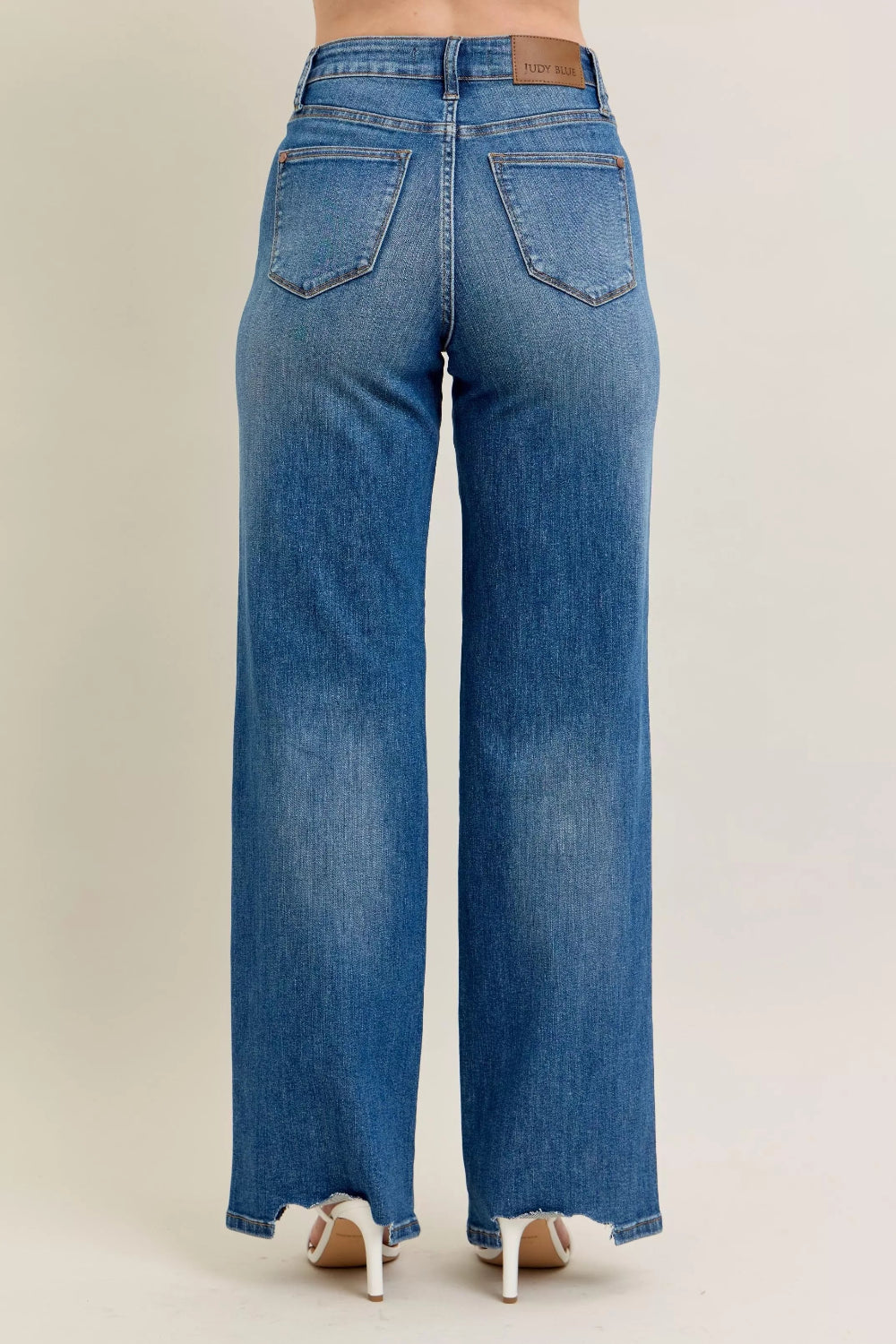 Judy Blue Jeans, full-size, high-rise, tummy control, medium wash, belt loops, button/zipper closure, pocketed, destroyed, chewed hem, wide leg, slightly stretchy, back view