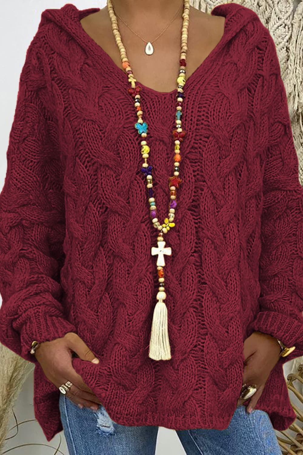 * Sweater
* Hooded
* Long sleeve
* Cable-knit
* Oversized
* Slightly stretchy