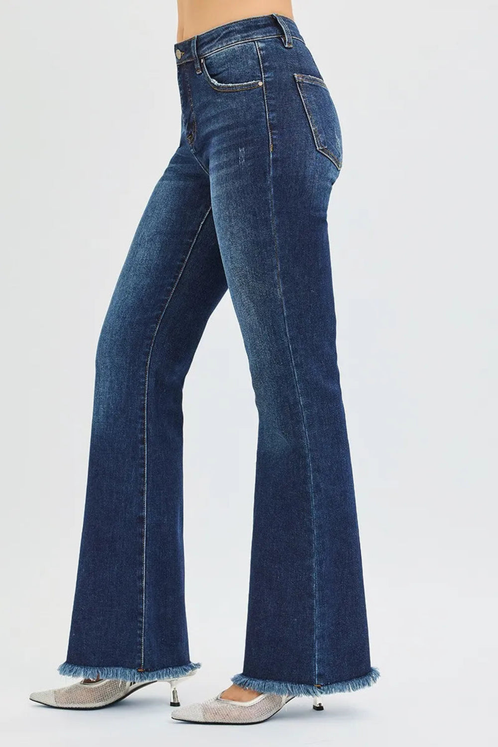 Risen jeans, full-size, high-rise, tummy control, flare, raw hem, distressed, 5-pocket detail, button-zipper closure, belt loop detail, dark vintage wash, slightly stretchy, side view