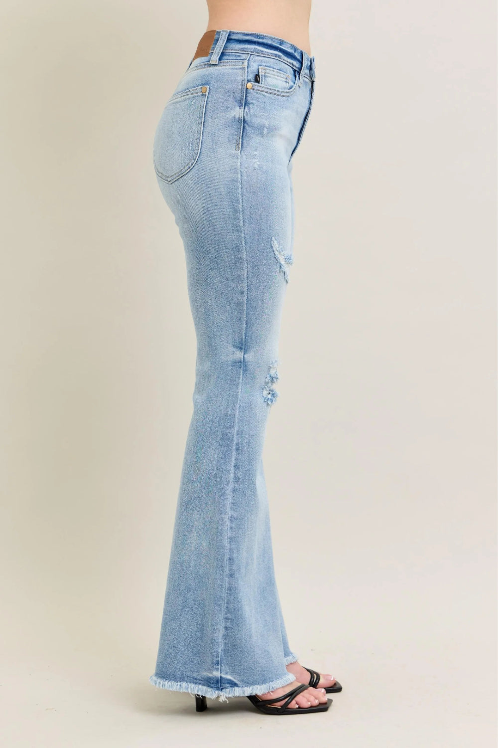 Judy Blue Jeans, full-size, high-rise, shield pocket, pocketed, flared, light wash, distressed knee, raw hem, stretchy, side view
