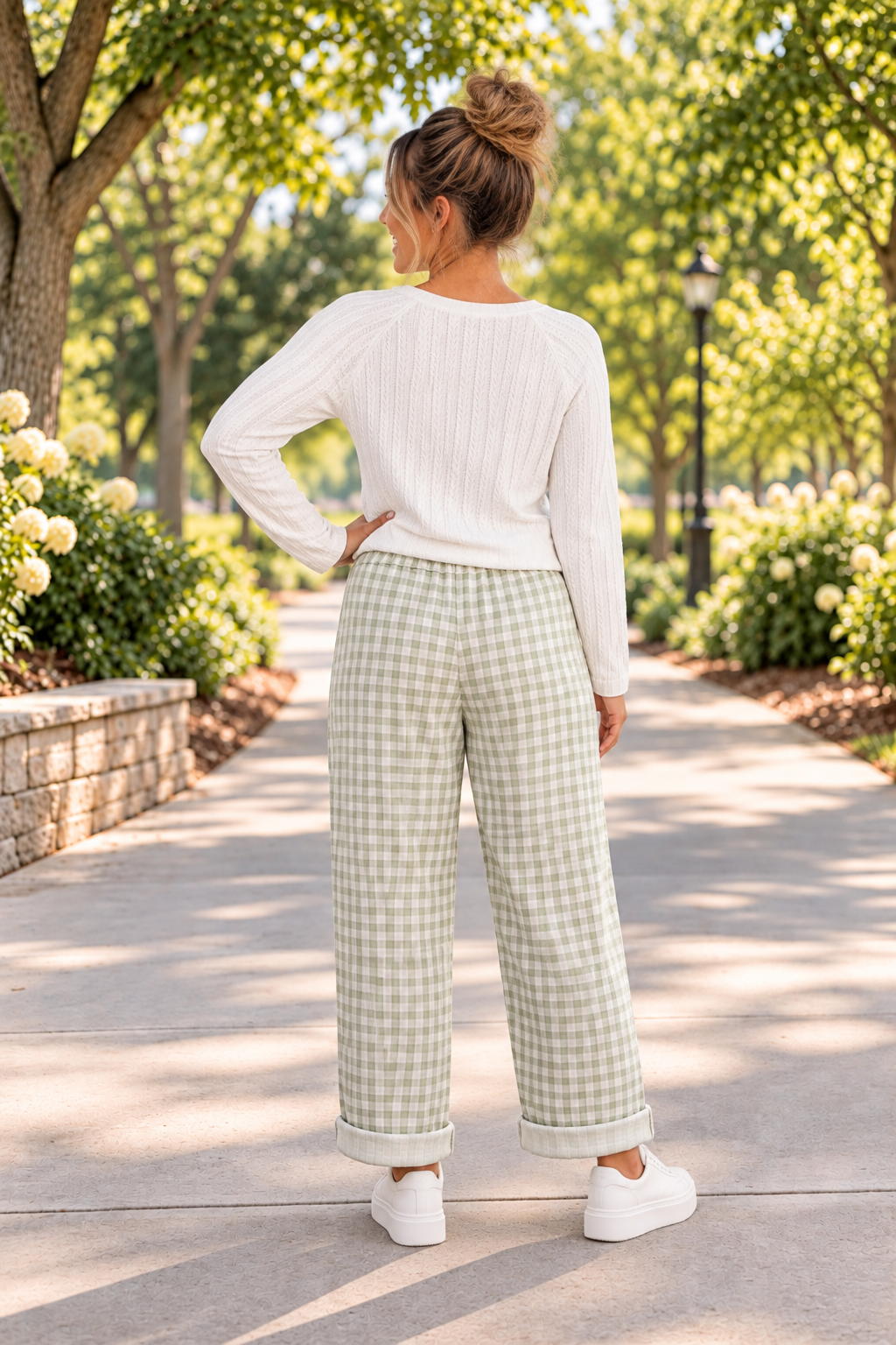 The Reece Pants in red and cream gingham with wide cuffed legs, a drawstring waist, front pockets, and vertical seams back view.