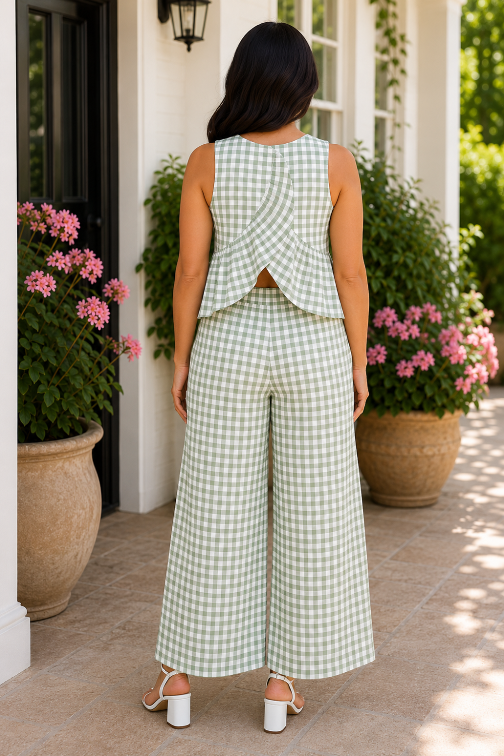 * Two-piece set
* Round neck
* Sleeveless
* Buttoned back closure
* Open back
* Elastic waist
* Pocketed
* Wide leg
* Ruffled
* No stretch