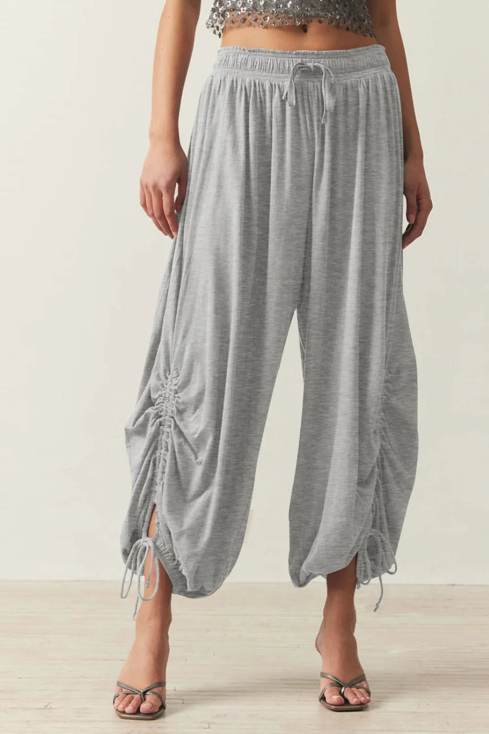 Pants, opaque, ruched, drawstring, elastic waist, opaque, pleated, adjustable hem ties, no stretch, front view
