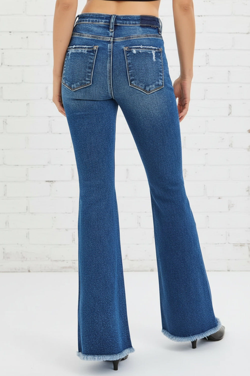 Risen Jeans, high-rise, flared, distressed, raw hem, belt loops, pocketed, button/zipper closure, slightly stretchy, back view