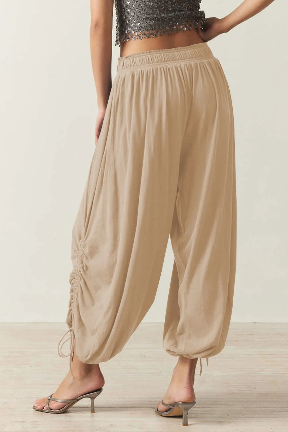 Pants, opaque, ruched, drawstring, elastic waist, opaque, pleated, adjustable hem ties, no stretch, back view
