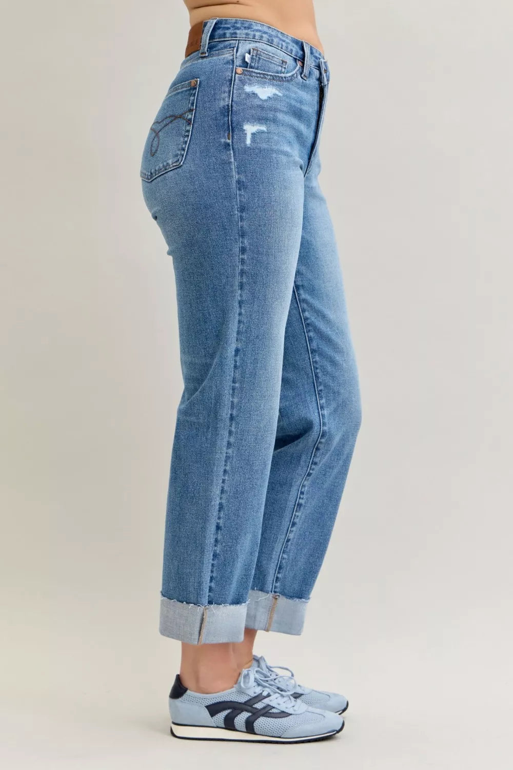 Judy Blue Jeans, high-rise, criss-cross front, mild destroy, single cuff, belt loops, button/zipper closure, pocketed, medium wash, slightly stretchy, side view