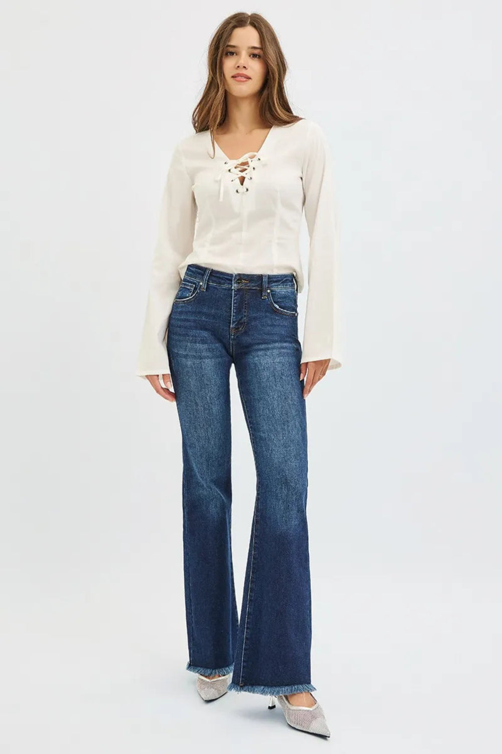 Risen jeans, full-size, high-rise, tummy control, flare, raw hem, distressed, 5-pocket detail, button-zipper closure, belt loop detail, dark vintage wash, slightly stretchy, front view